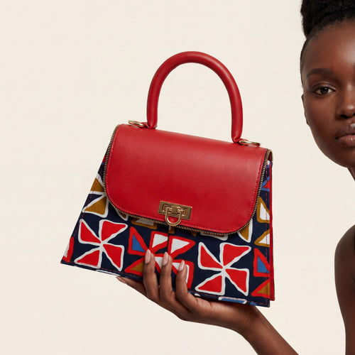 Sac Bijoux rouge porté à la main, ELVI CREATION, conçu en France, fait main à Lomé