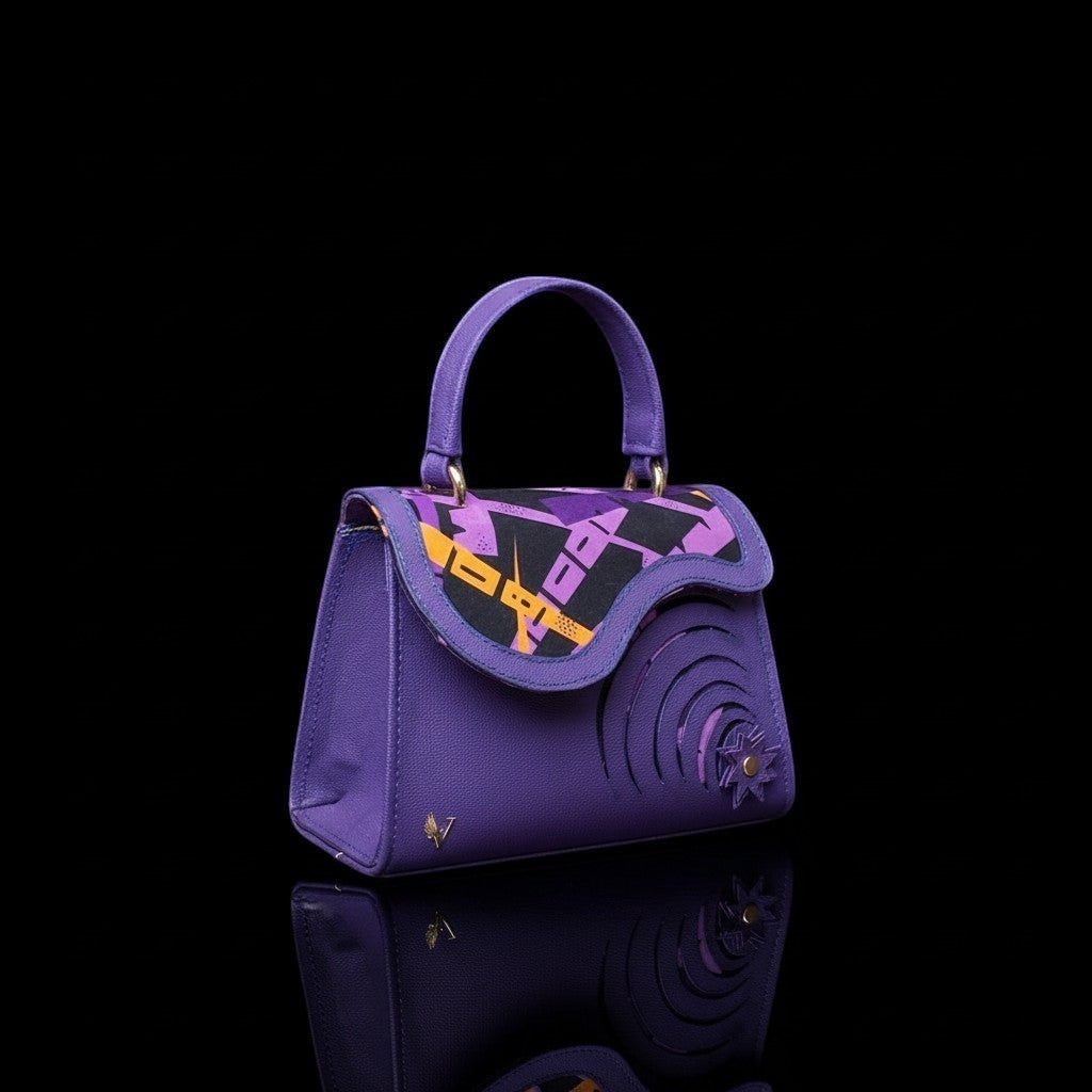 ELVI CREATION Elsha mini purple vegan leather handbag with floral appliques, spiral cutouts, and wax lining.