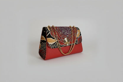 ELVI CREATION Rosa red vegan leather handbag with a large floral wax print flap and gold chain strap.