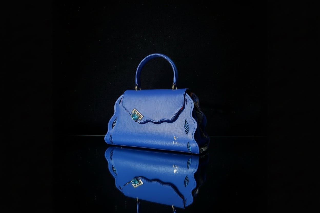ELVI CREATION Trésor blue vegan leather handbag with wavy edges and gold hardware. Perfect for day or evening.